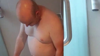 Even on vacation the slave has to give a blowjob in the shower