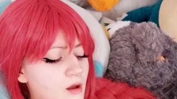 Cosplayer with red wig fingers herself hard and gets fucked by a fuck machine.